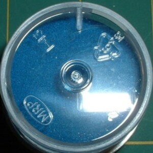 May include: A blue plastic container with a clear lid. The lid has a recycling symbol and the number 1. The container has the word "MRP" printed on it.