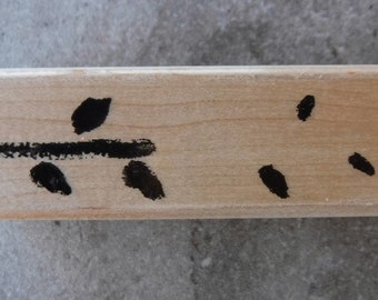 May include: A wooden stamp with black ink showing a stylized tree with branches and leaves. The stamp is labeled with the text "© 2009 STAMPIN' UP!"
