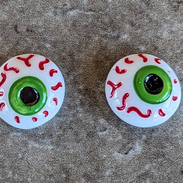 2 Blood Shot Eyes Flat Back Buttons Size 9/16"