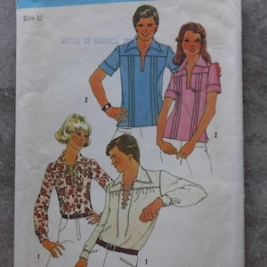 May include: Simplicity sewing pattern number 6957, size 10, for a shirt with a lace-up collar. The pattern includes three different shirt designs, one with a blue and white striped pattern, one with a pink and white striped pattern, and one with a floral pattern.