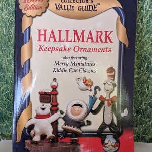 May include: 1999 edition Hallmark Collector's Value Guide book featuring a variety of Keepsake Ornaments, including a polar bear, a girl in a parka, and the Cat in the Hat.