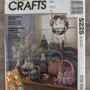 May include: McCall's Crafts pattern for springtime decorations. The image shows a variety of Easter-themed crafts, including baskets, a tree, and bunny figures. The pattern is titled "Springtime in the '90's" and includes the designer's name, MartiMichell.