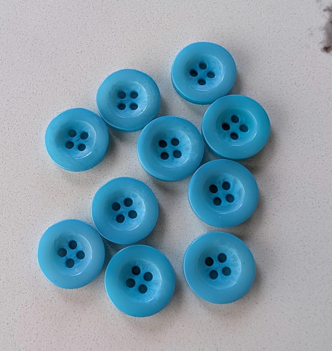 10 Light Teal Spotty Flat Rim Round Buttons Size 9/16