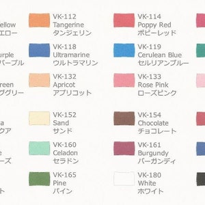 May include: A color chart with 18 different paint colors, each with a name and a Japanese translation. The colors include lemon yellow, tangerine, poppy red, cherry pink, peony purple, ultramarine, cerulean blue, emerald, spring green, apricot, rose pink, bubble gum, pale aqua, sand, chocolate, brick, ash rose, celadon, forest, pine, white, and real black.