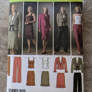 May include: Simplicity Easy Chic sewing pattern featuring various women's suit and dress designs. The pattern includes a blazer, skirt, pants, and a dress. The pattern is size HH 6, 8, 10, 12. The design is by Karen Z.