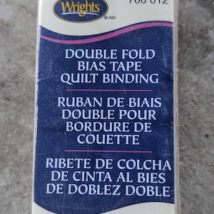 May include: A set of three ceramic mugs with a speckled, matte finish. The mugs are in shades of cream, light brown, and dark brown. Each mug has a simple, minimalist design, perfect for coffee or tea.
