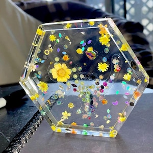 May include: A set of three ceramic nesting bowls in shades of blue, green, and white. The bowls feature a speckled glaze and a simple, modern design. The largest bowl measures approximately 6 inches in diameter.