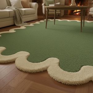May include: A green area rug with a wavy, cream-colored border. The rug is placed on a hardwood floor and is in a living room setting. The rug's design adds a soft, textured element to the room's decor.