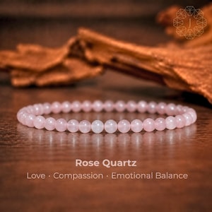 May include: A circular bracelet composed of small, smooth, pale pink rose quartz beads. The text below the bracelet reads: Rose Quartz, Love · Compassion · Emotional Balance. The beads are uniform in size and arranged in a single continuous loop.
