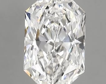May include: A clear, elongated diamond with a complex, multi-faceted cut. The gemstone is suspended against a neutral gray background, showcasing its brilliance and clarity. The diamond's shape is symmetrical, with pointed ends and a rectangular body.