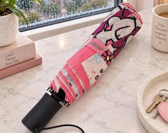 Paraguas de Snoopy, paraguas plegable rosa con estampado floral de Peanuts, paraguas de viaje, regalo de Snoopy