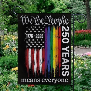 May include: Black garden flag with the text "We the People" and "250 YEARS". The flag features a distressed American flag design with rainbow stripes and the words "means everyone".