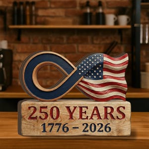 May include: A wooden sculpture featuring an infinity symbol intertwined with a waving American flag. The base reads "250 YEARS 1776-2026" in red lettering. The sculpture is made of wood and has a rustic, patriotic theme.