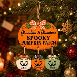 May include: A hanging wooden ornament shaped like a large orange pumpkin with a plaid bow, inscribed with Grandma & Grandpa's SPOOKY PUMPKIN PATCH. Three smaller pumpkin ornaments hang below, labeled Alice, Rapunzel, and Peter with bows.