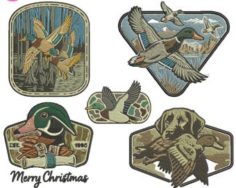 May include: A collection of embroidered patches featuring duck designs. The patches include images of ducks in flight, a duck head, and a hunting dog with a duck. The text "05+ Hunting Duck Design" and "Merry Christmas" are also present.