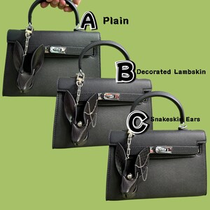 Comparison of three goth luxury bunny leather bag charm variations on black handbags: A Plain minimalist lambskin bunny charm, B Decorated Lambskin bunny charm with metal chain accents, and C Snakeskin Ears bunny charm featuring snakeskin ear detail. Handmade dark gothic purse charms designed as statement handbag charms for luxury bags and edgy fashion styles.