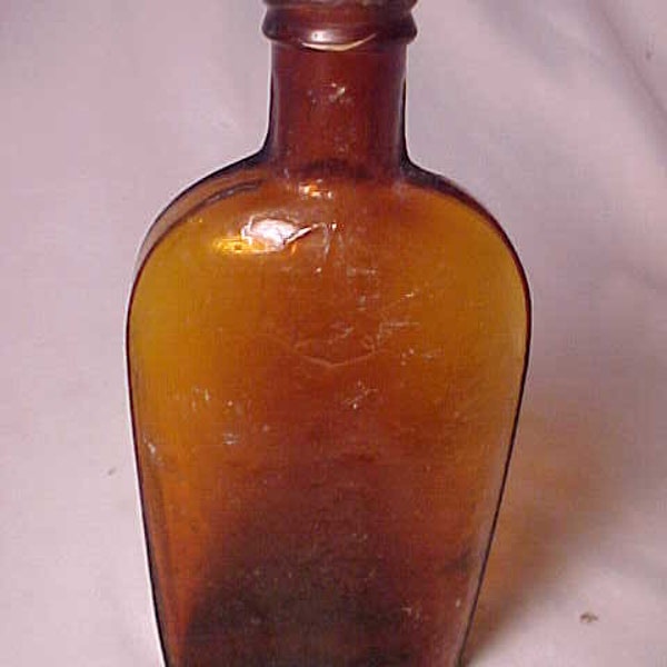 c1890s One Half Pint Amber Strap Side Blown Glass Whiskey Flask with an embossed Star in a circle, Country Primitive Decor, Back Bar Bottle