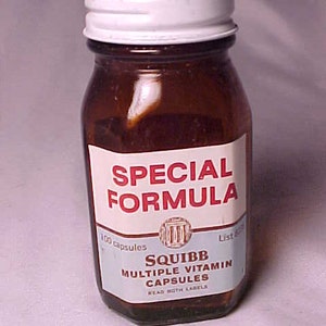 May include: A brown glass bottle with a white lid containing Squibb Special Formula Multiple Vitamin Capsules. The label reads "Squibb Special Formula 100 capsules List 625 Squibb Multiple Vitamin Capsules Read Both Labels".