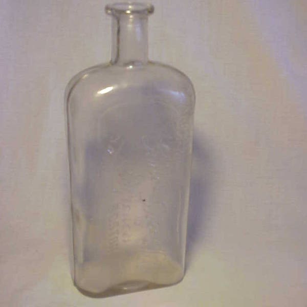 c1890s Ginter Grocery Co. Importers Boston, Mass., One Quart Clear Strap Side Whiskey Flask