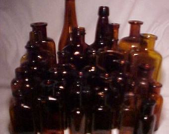 c1890-1930 Group of 25 Cork Top Mixed Amber Glass Medicine & Beverage Bottles, Great for Wedding Decor 3 1/2 to 9 1/4 inches tall, Lot No. 1