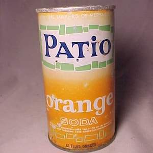 May include: A vintage aluminum can of Patio Orange Soda. The can is yellow with green and white accents. The text "Patio" is in blue letters and the text "Orange Soda" is in white letters. The can is 12 fluid ounces.