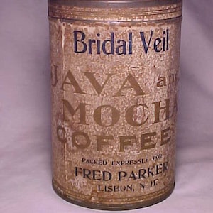 May include: A vintage tin can for Bridal Veil Java and Mocha Coffee, packed expressly for Fred Parker in Lisbon, NH. The can is brown with gold lettering and a white background.