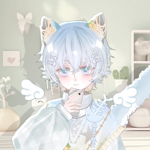 May include: An anime-style illustration of a character with light blue hair and cat ears, holding a smartphone. The character wears a light blue outfit with angel wing accents. The background features a light green wall with decorative shelves and a window.