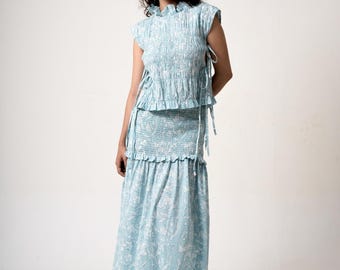 Iris Top Sky Blue with White Florals Softly Structured Smocked Body Ruffled Neckline, Cap Sleeves, Adjustable Side Ties for Flattering Fit