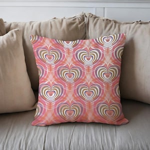 May include: A white ceramic mug with a black handle and the text "But First, Coffee" in a black, handwritten-style font. The mug is on a white surface.