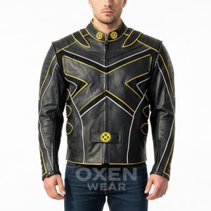 May include: Black leather jacket with yellow and white accents, featuring an X-shaped design on the front and the text "OXEN WEAR" at the bottom. The jacket has a stand-up collar and a small logo on the chest.