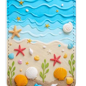 May include: A rectangular accessory with a beach theme, featuring a blue wave design at the top and a sandy beach scene below. It includes various seashells, starfish, and sea plants in yellow, orange, red, and white. A silver ring is attached at the top.