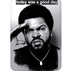 May include: Black and white graphic of a man saluting, with the text "today was a good day" at the top. The image is on a rectangular tag with a metal ring at the top for hanging.