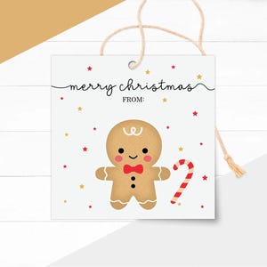 May include: A square Christmas gift tag featuring a gingerbread man illustration. The tag has the words "merry christmas" and "from" in black script. Red and gold stars surround the gingerbread man and candy cane.