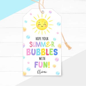 May include: A white gift tag with a yellow smiling sun and colorful bubbles. Text reads "Hope your Summer Bubbles with Fun!" and "Olivai" in a handwritten font. A natural twine string is attached.