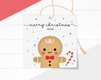 May include: A square Christmas gift tag with a gingerbread man illustration. The tag has the words "merry christmas" and "from" in black script. The gingerbread man has a red bow tie and a candy cane.