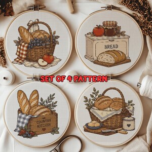 May include: A set of four circular embroidery hoops featuring cross-stitch patterns of bread, baskets, and kitchen items. The text SET OF 4 PATTERN is printed in red. Each hoop displays detailed illustrations of loaves, fruit, and jars on fabric.