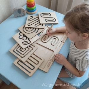 May include: A set of light-colored wooden tracing boards featuring various engraved patterns including swirls, squares, and lines. A wooden stylus is used to trace the grooves on the boards. A colorful stacking toy and a gray elephant figure are nearby.