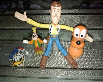 Vintage Disney Misc Lot Includes Toy Story's Woody Bendy, Donald Duck, Goofy, Pluto