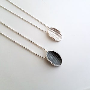 Pendant made in sterling silver with textured surface Silver