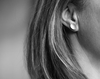 Earring studs in silver domed oval with linen textured finish