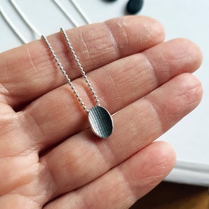Pendant made in sterling silver with textured surface Black