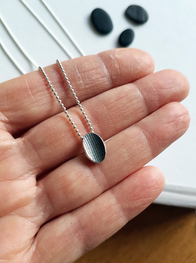 Pendant made in sterling silver with textured surface Black