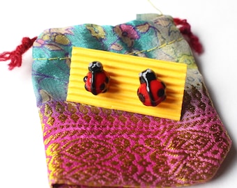 Lampworked glass ladybird ear studs earrings ladybug love bug glassblowing boro borosilicate spots red jewellery