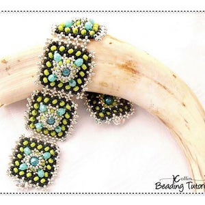May include: A beaded bracelet with square links, featuring black, lime green, and turquoise beads. The bracelet is displayed on a light-colored, curved object. The design includes a central turquoise bead surrounded by lime green beads.