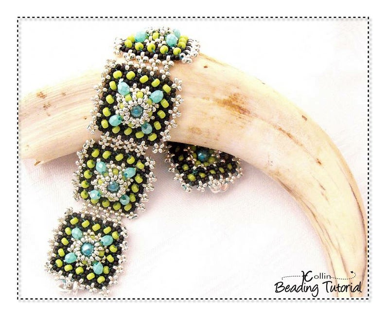 May include: A beaded bracelet with square links, featuring black, lime green, and turquoise beads. The bracelet is displayed on a light-colored, curved object. The design includes a central turquoise bead surrounded by lime green beads.