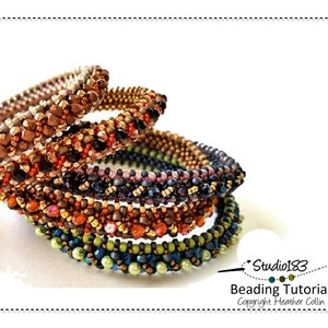 May include: Five beaded bracelets in shades of brown, green, and black. The bracelets are stacked on top of each other, with the largest bracelet at the bottom and the smallest bracelet at the top. The bracelets are made with small beads and have a woven pattern. The text "Studio183 Beading Tutorial Copyright Heather Collin" is visible in the bottom right corner of the image.