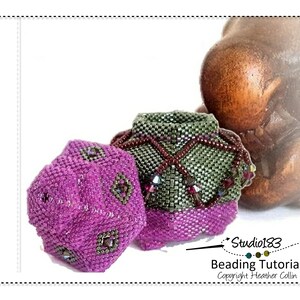 May include: Two beaded, geometrically shaped containers, one purple and one green, with a beaded fringe. The containers are on a wooden surface. The image includes the text "Studio183 Beading Tutorial Copyright Heather Collin".