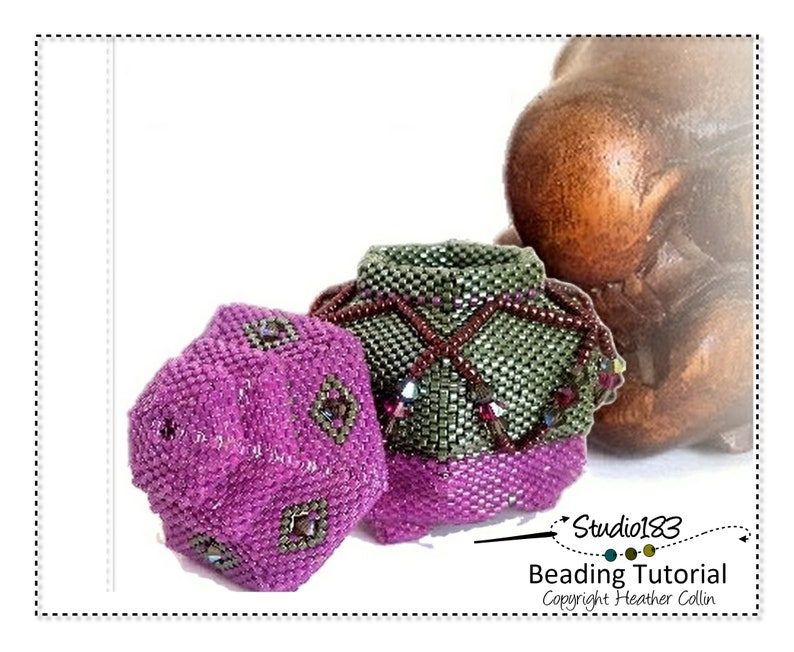 May include: Two beaded, geometrically shaped containers, one purple and one green, with a beaded fringe. The containers are on a wooden surface. The image includes the text "Studio183 Beading Tutorial Copyright Heather Collin".
