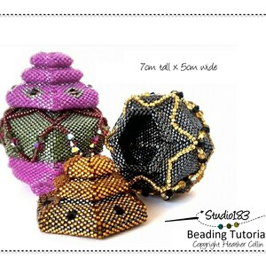 May include: Three beaded ornaments in different colors and patterns. The largest ornament is purple and green, the middle ornament is black and gold, and the smallest ornament is gold and black. The ornaments are 7cm tall and 5cm wide. Studio183 Beading Tutorial. Copyright Heather Collin.