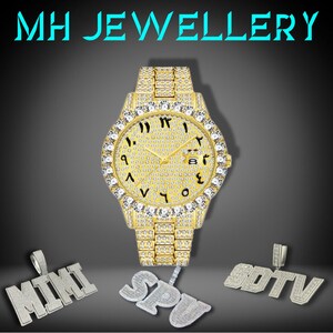 May include: A gold wristwatch with a diamond-set bezel and strap. The watch face displays Arabic numerals. Beneath the watch are three diamond pendants spelling "MIMI", "SPU", and "SDTV". The text "MH JEWELLERY" is at the top.